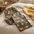 Charcoal grey Golden Sun wide-leg lounge pants with gold sun pattern